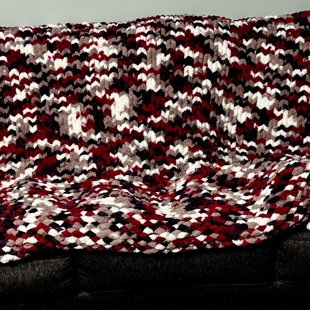 Handmade chunky knit blanket in maroon, purple, gray & white.